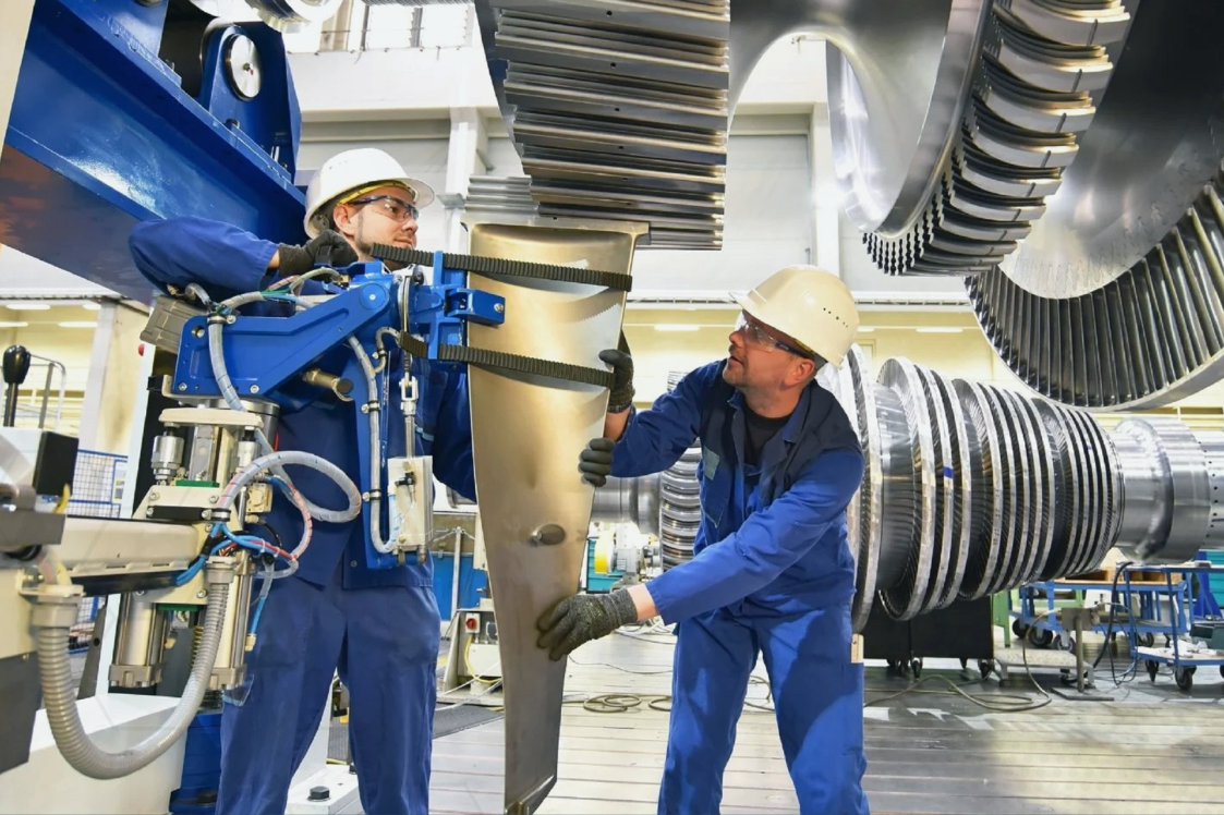 A manufacturing team working in alignment